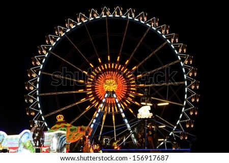 MUNICH, GERMANY - SEPTEMBER 25: Big wheel at the Oktoberfest in Munich, Germany on September 25, 2013. The Oktoberfest is the biggest beer festival of the world with over 6 million visitors each year.