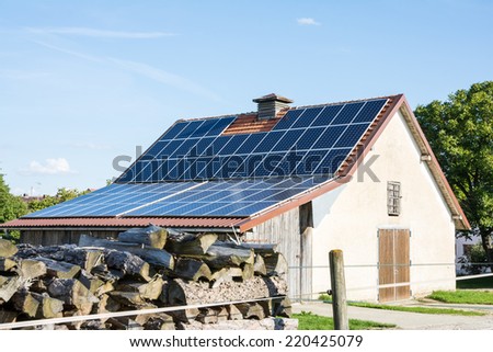 Farm building with innovative roof for alternative energy creation