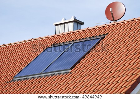 Solar heating system on the roof of a house