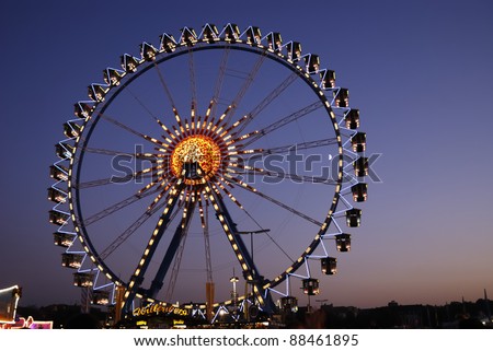 MUNICH, GERMANY - OCT 3: Big wheel at the Oktoberfest in Munich, Germany on October 3, 2011. The Oktoberfest is the biggest beer festival of the world with over 6 million visitors each year.