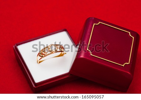 Fantastic gold ring adorned with several white zirconia
