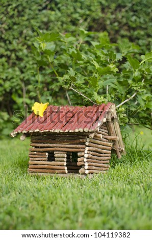 Small wooden house in the garden.