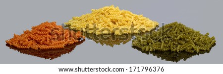 3 piles with italian Fusilli noodles in reflective back
