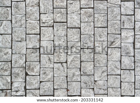 full frame detail of grey cobblestones