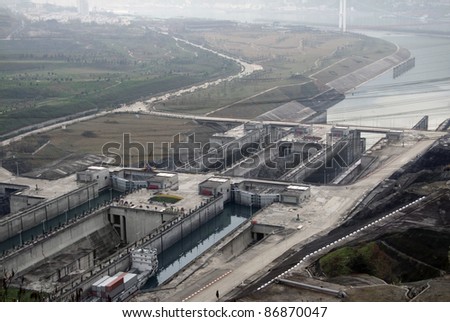 high angle view showing the Three Gorges Dam at Yangtze River in China at evening time in misty ambiance