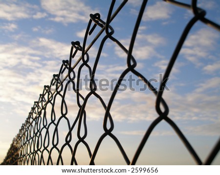 wire fence close up with sky