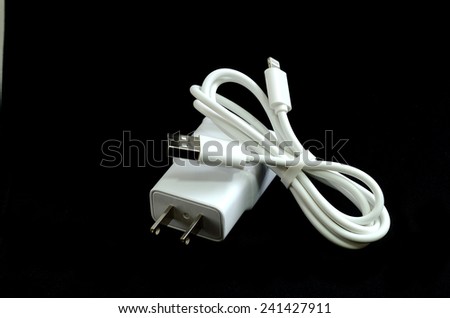 Cell phone charger isolate on black