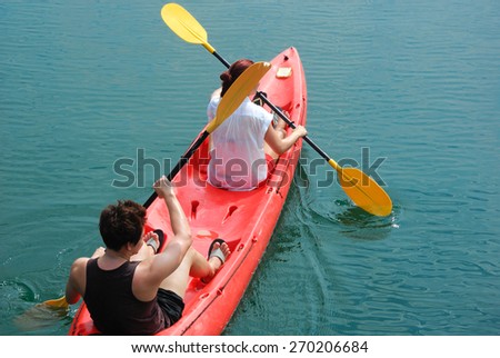 Traveler paddle a kayak on the sea. Kayaking on island