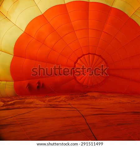 Beautiful inside big balloon on ground before input gas
