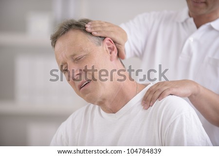 Chiropractic: Chiropractor doing neck adjustment