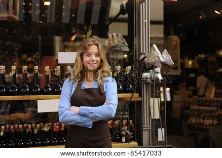 small business owner in front of store