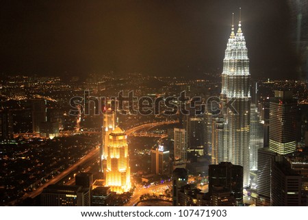 KUALA LUMPUR - NOV 26: The Petronas Twin Towers on November 26, 2011, in Kuala Lumpur, Malaysia are the world\'s tallest twin tower. The skyscraper height is 451.9m