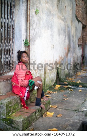 PENANG - MALAYSIA - APRIL 5 2013: Homeless woman in Alleyway of Georgetown, Penang (World Heritage Town) in Malaysia