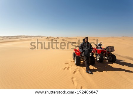 NAMIBIA - OCTOBER 27 2013: Quad biking can cause impact on the diverse sand dune ecosystem if not done in a sustainable way in Namibia, Africa