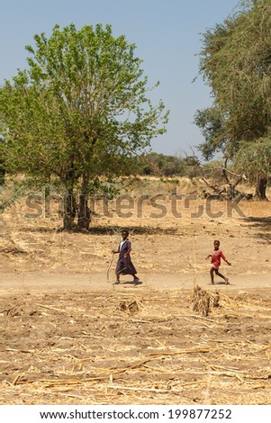 KATIMA MULILO, NAMIBIA - OCTOBER 16 2013: Local life goes on at the fields during a year of drought in the North Eastern town of Katima Mulilo in Namibia, Africa