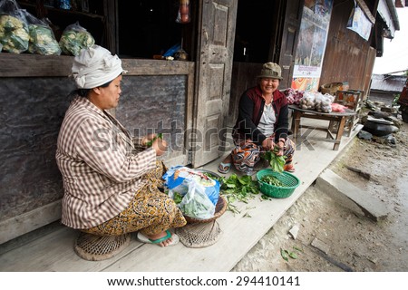 CHIN STATE, MYANMAR - JUNE 23 2015: Preparing vegetables in village in the recently opened to foreigners area of Chin State - western Myanmar (Burma)
