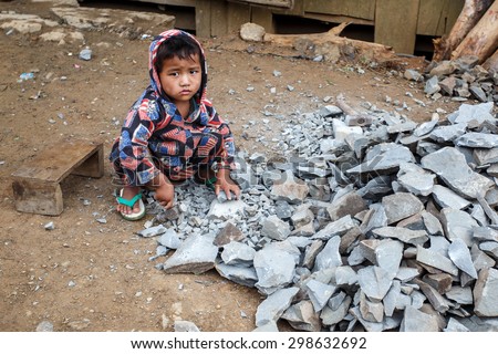 CHIN STATE, MYANMAR - JUNE 22 2015: Child labour in the recently opened for tourists Chin State Mountainous Region, Myanmar (Burma)