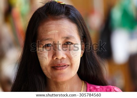 CHIN STATE, MYANMAR - JUNE 18, 2015: Beautiful lady with thanaka painted face in the recently opened for tourists Chin State Mountainous Region, Myanmar (Burma)