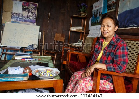 CHIN STATE, MYANMAR - JUNE 18 2015: Lady sitting in house in the recently opened for tourists Chin State Mountainous Region, Myanmar (Burma)