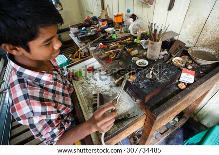 CHIN STATE, MYANMAR - JUNE 18 2015: Skilled metal work in the recently opened for tourists Chin State Mountainous Region, Myanmar (Burma)