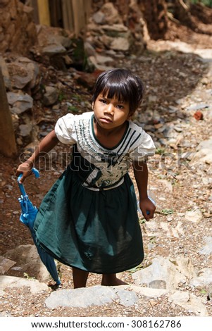 CHIN STATE, MYANMAR - JUNE 18 2015: Cute school girl in the recently opened for tourists Chin State Mountainous Region, Myanmar (Burma)