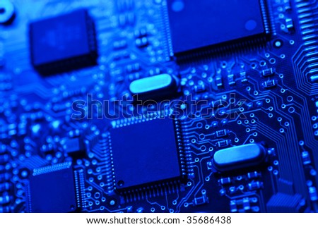 Blue high tech mother board with chip components background