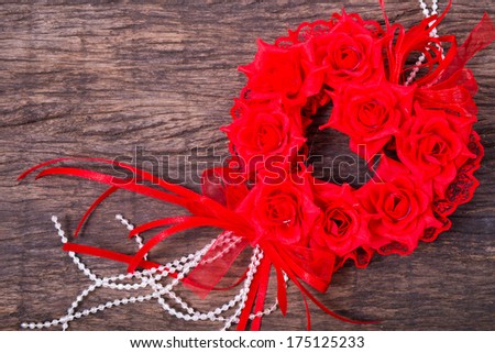 Heart shaped roses bouquet on wooden table top