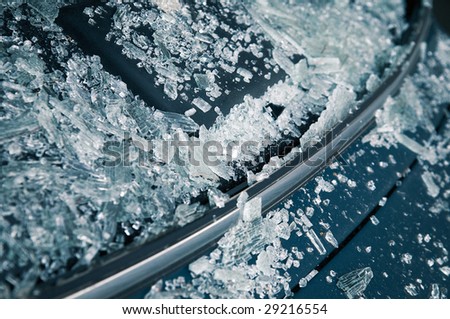 Close-up at broken car windshield. Tint blue