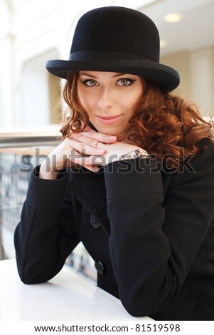 Portrait of a beautiful young woman in hat