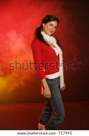 girl wrapped up in red sweater and white scarf for her walk on red and gold background