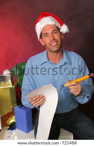 guy in santa hat is double checking his list for the holidays surrounded by gifts in a misty red background