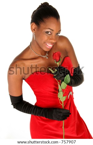 girl in red gown smelling a rose isolated on white in vertical format