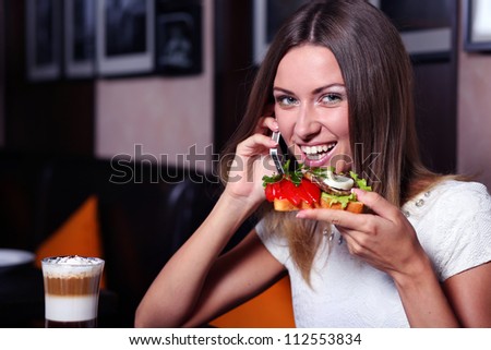 Corporate woman at a restaurant having a business lunch
