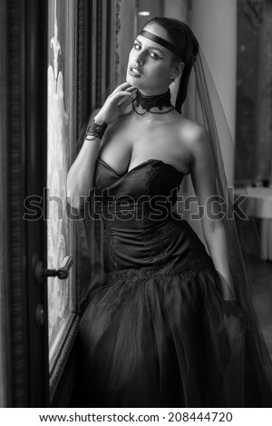 Fashion model wearing black wedding dress