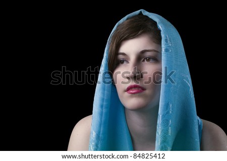 Young women black hair and blue scarf, with black background