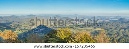 shadow of the peak of hill on landscape of Lusatian mountains - panoramic view from top during sunset