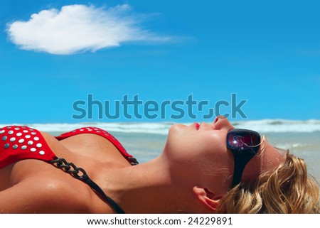 Perfect Holidays! Young girl is taking a sun bath