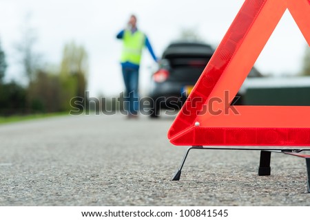 Similar – Image, Stock Photo Accident. A warning traffic cone is on wet ground. traffic cone, traffic cone, pylons, traffic cone.