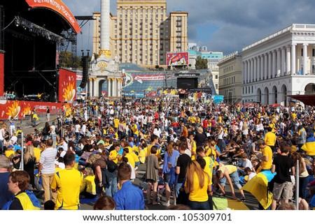 KIEV, UKRAINE - JUNE 15: Crowd of fans from different countries walking in the Fan-Zone of Euro 2012 on June 15, 2012 in Kiev, Ukraine. The Ukrainian host cities are Lviv, Donetsk, Kharkiv and Kiev.