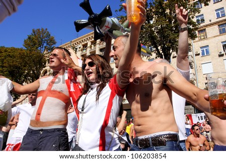 KIEV, UKRAINE - JUNE 24: English soccer fans go crazy in Fan-Zone of Euro 2012 on June 24, 2012 in Kiev, Ukraine. The slogan of EURO 2012 Football Championship is \