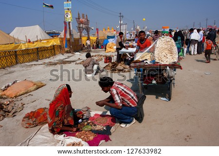 ALLAHABAD, INDIA - JAN 27: Street sellers of spices and food work during the biggest festival in the world - Kumbh Mela, on January 27 2013 in Allahabad India. Mela 2013 will take 130 000 000 visitors