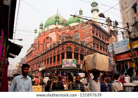 KOLKATA, INDIA - JAN 13: Traffic on the street near the Nakhoda Masjid mosque on January 13, 2012 in Kolkata. The total cost incurred for the Mosque construction was 1,500,000 Indian rupees in 1926.