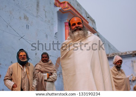 UTTAR PRADESH, INDIA - JAN 27: Elderly servant temple with a beard wrapped in a white sheet outdoors on January 27, 2013 in Ayodhya, India. Uttar Pradesh is the 5th largest state with 200 mill. people