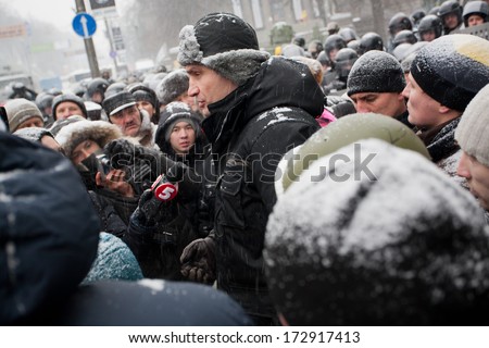 KIEV, UKRAINE  - JAN 21: Popular ukrainian opposition politician Vitali Klitschko gives interviews to journalists and the public in the crowd during anti-government protest on January 21 2013 in Kyiv