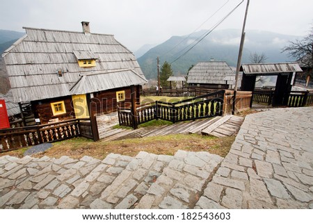 Wooden village with cobbles street lost in the mountains of Eastern Europe