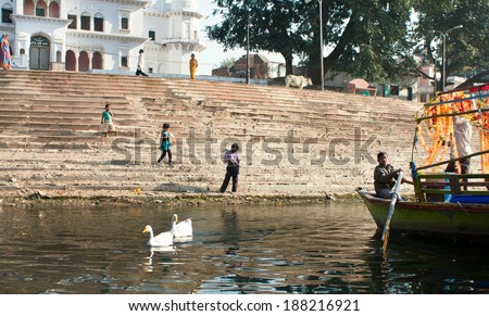 CHITRAKOOT, INDIA - DEC 28: Unidentified children play outdoor near the river bank with caming boat on December 28, 2012. Population of Chitrakoot is 22,294. By the legend, Lord Rama lived here