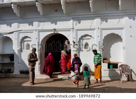 MADHYA PRADESH, INDIA - DEC 27: Unidentified children and poor people came inside the yard of historical hindu temple for pray on December 27, 2012 in Chitracoot. Population of Chitrakoot is 22,294