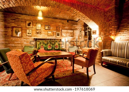PRAGUE - MAY 16: Interior of cozy cafe with armchairs and sofas in the style of an old apartment in a historical house on May 16, 2014. Prague receives more than 4.4 million visitors annually