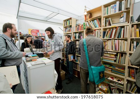 PRAGUE - MAY 16: Happy students choose books at the indoor second hand market on May 16, 2014 in Czech Republic. Fourteenth-largest city in the European Union, Prague is home to 1.3 million people