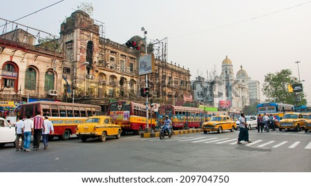 KOLKATA, INDIA - JAN 22: Panorama with traffic of taxi cars and different transport on old busy city road on January 22, 2013 in Calcutta. Kolkata has a density of 814.80 vehicles per km road length